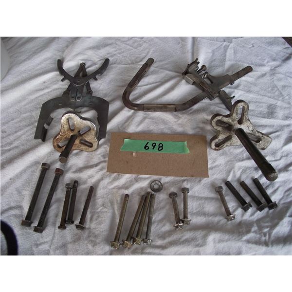 1 Large and 1 small 2/3 point bearing pullers with assorted bolts. 2 piston cleaning devices.