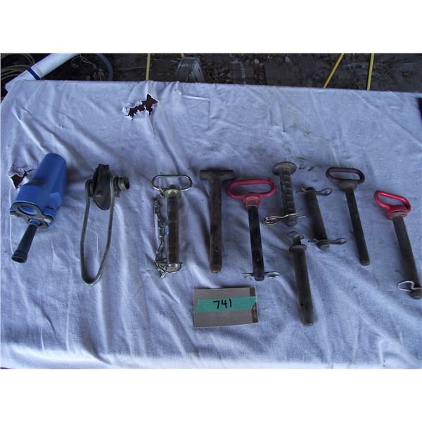 8- Assorted hitch pins, 1- jet pump orifice (new) and 1- boat motor test muff.