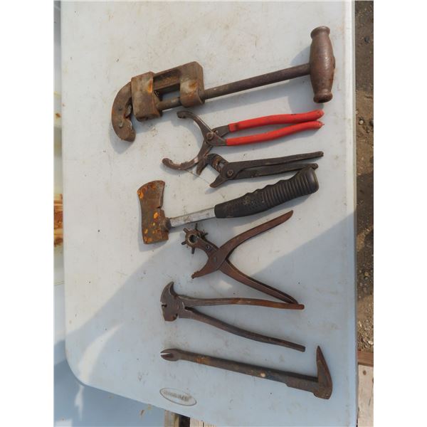 hatchet, pipe cutters , oil filter wrench , fence nail tool