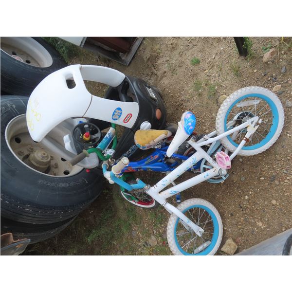 children's bikes and little tikes police car