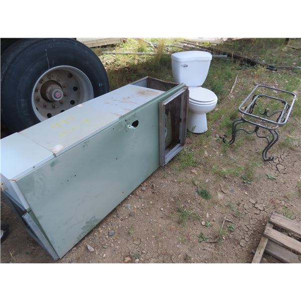 gas furnace , toilet and coffee table that needs glass