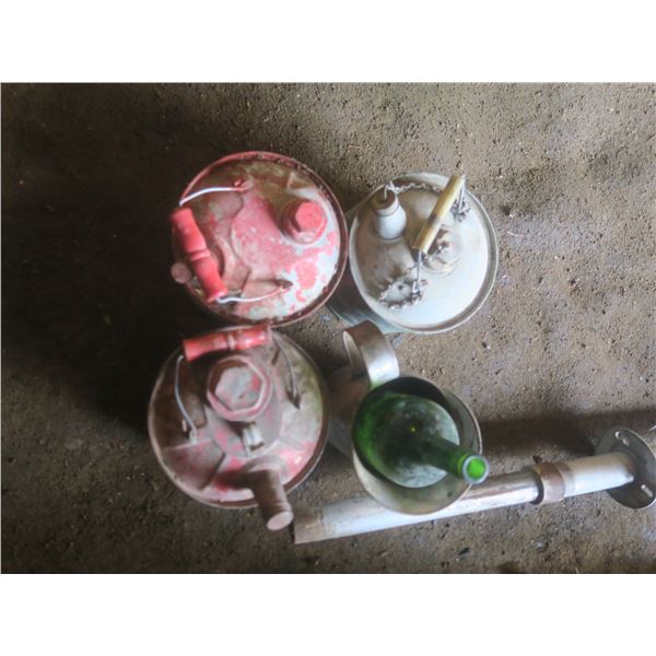 3 vintage gas cans and a oil jug and glass bottle