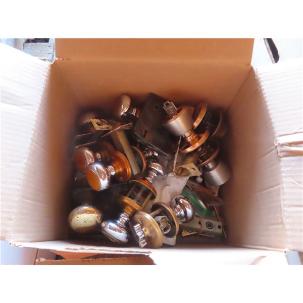 box of doorknobs and hardware