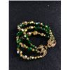 Image 1 : Vintage Art Deco Green & Gold Glass Triple Stand Bracelet. Signed
