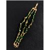 Image 2 : Vintage Art Deco Green & Gold Glass Triple Stand Bracelet. Signed