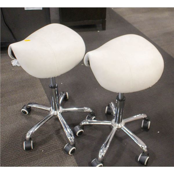 2 FLOOR MODEL WHITE SADDLE SEAT ROLLING CHAIRS
