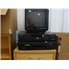 Image 1 : Small bookcase with set of drawers, Sylvania AC/DC remote television, DVD player, Sony VHS recorder,