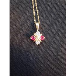 Diamond and ruby necklace chain is marked 14kt  (266)
