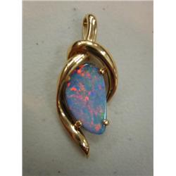 Elegant fire opal in gold setting 266)