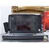 Image 1 : Tandy laptop computer with carrying case, and portable DVD player new in box (266)