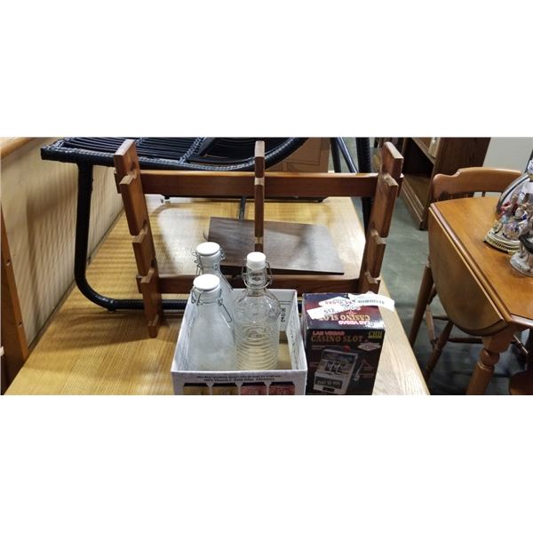 BOX OF GLASS BOTTLES, SMALL SLOT MACHINE AND WOODEN RACK