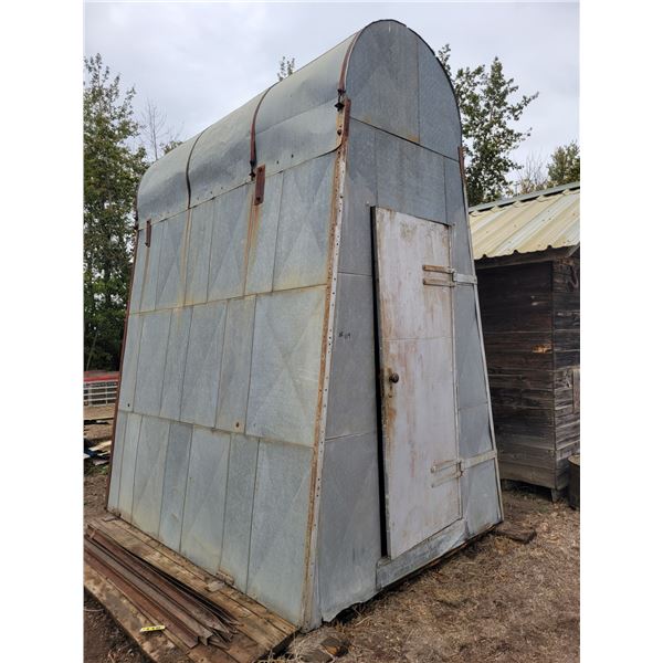 Enclosed gravity fuel tank building c/w fuel tank