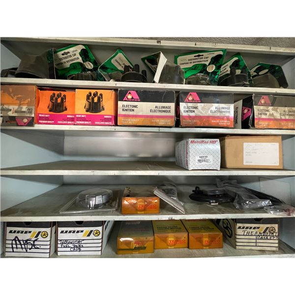 Contents of cabinet, distributer caps, thermostats, trailer plugs