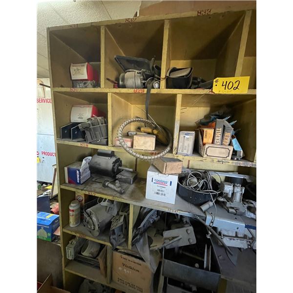 Contents of center shelf. Motors, pressure gauges, fittings, wire etc.