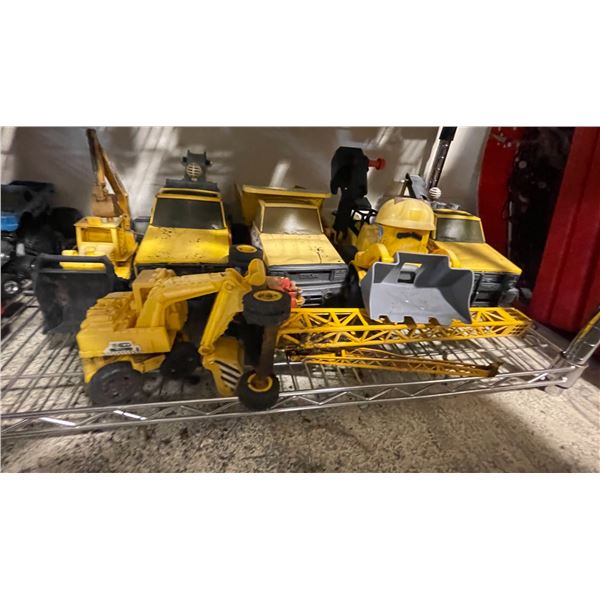 Shelf lot - Tonka trucks including dump trucks, front end loaders, bulldozer, excavator