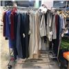Image 1 : Rack full of assorted set dec clothing - includes skirts / blazers / dresses / dress shirts / long s
