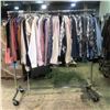 Image 1 : Rack full of assorted set dec clothing - includes shirts/etc. (approx. 120 pcs)