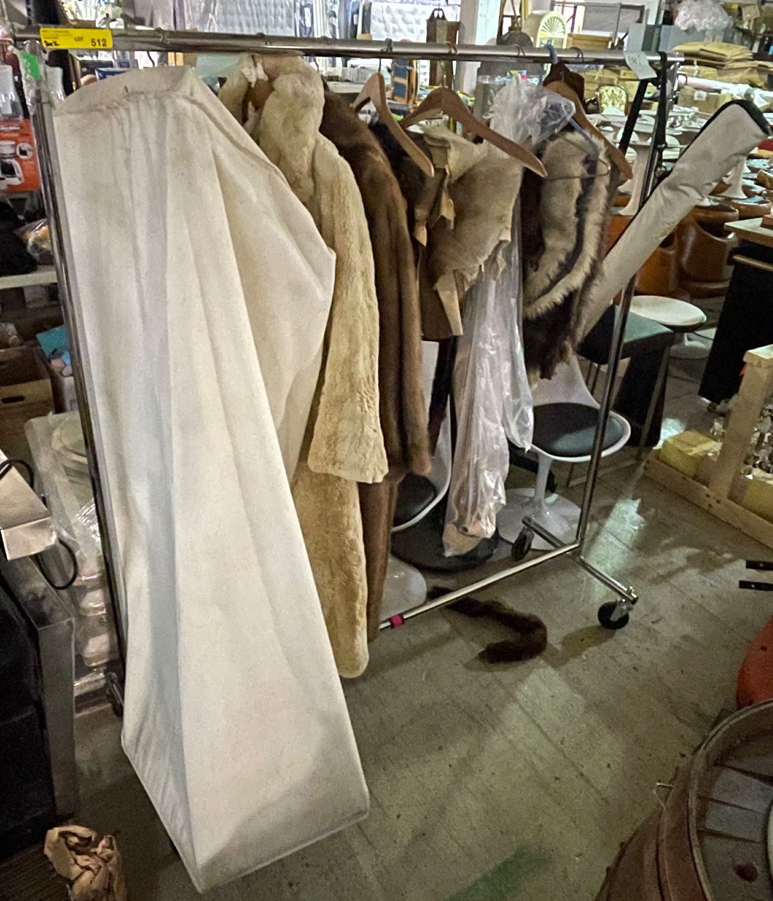 Rack of fur coats and other misc. fur items