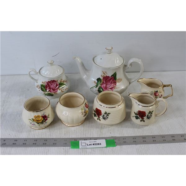 (2) Teapots, (3) Sugar Dishes and (2) Creams