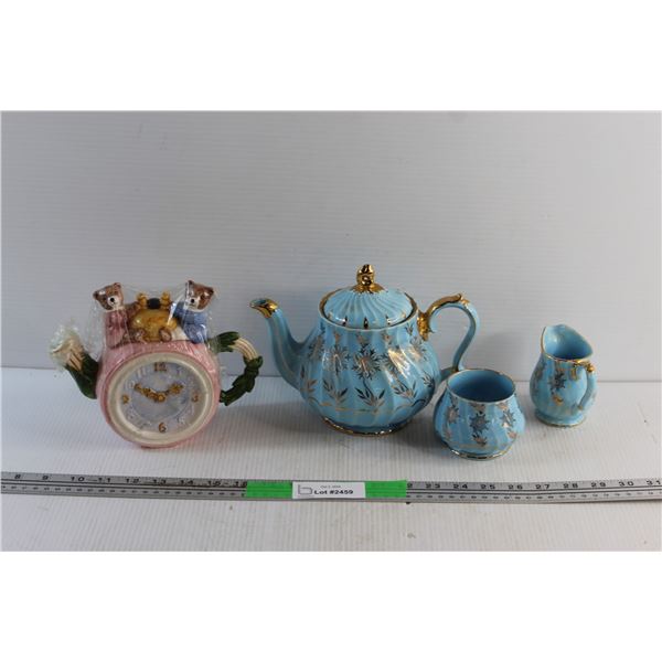 Cream & Sugar Tea Set and a Tea Pot