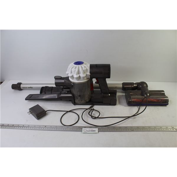 Tyson Vacuum w/Charger (not running - may need charging? - cannister is taped - as is)