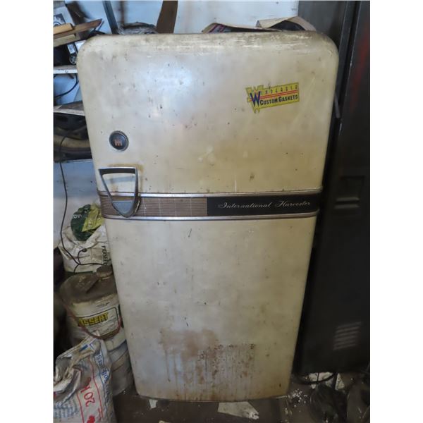 vintage fridge with welding wire, welding rods and assorted hardware