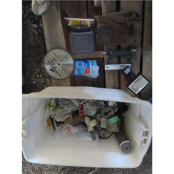 tote with plumbing and assorted tools