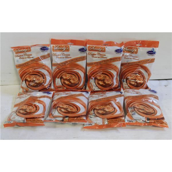 EIGHT PACKAGES OF SWIRLY’S BUTTERCREAM CANDY