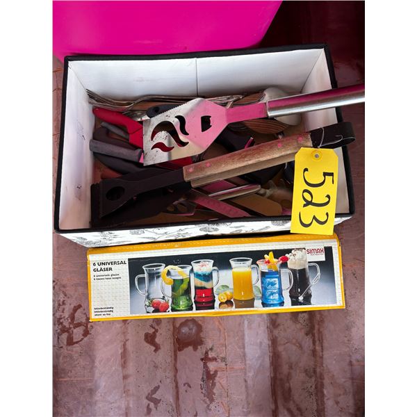 Pink tote of caps, belt buckles, very fancy level, shoe kit, projector, cutlery