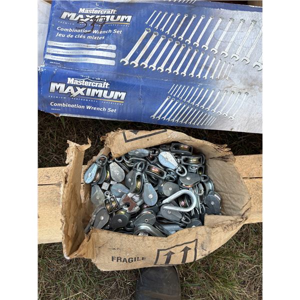 2 Metal saw horses, tow straps, 3 hammers, 30pc wrench set up to 1 1/8, pulleys & meat slicer still 