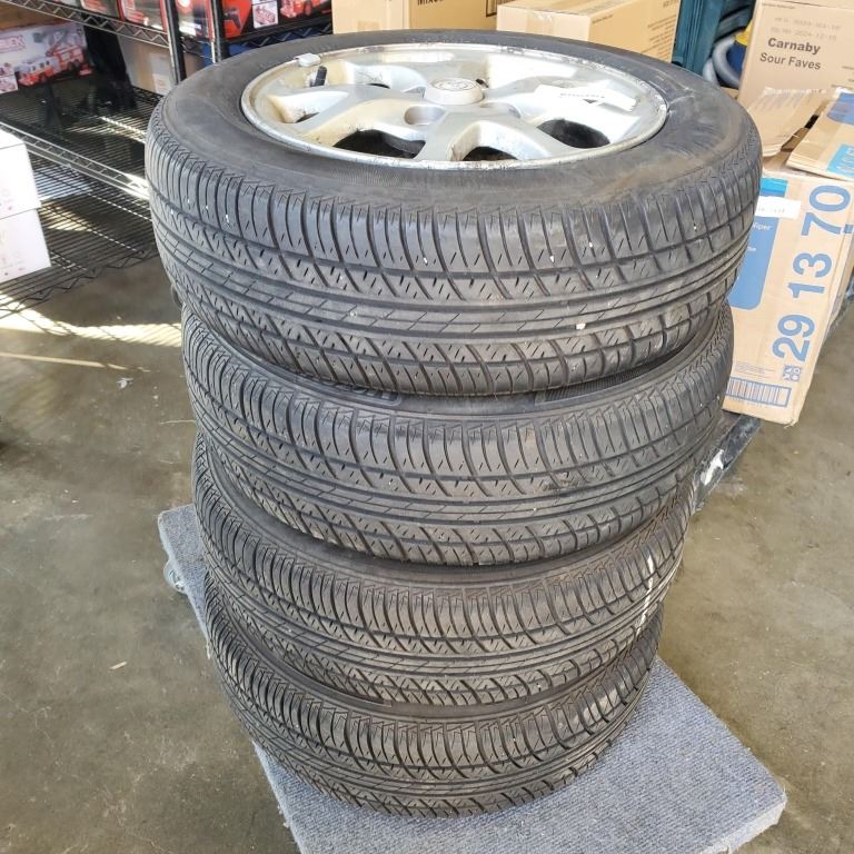 SET OF FOUR MOTOMASTER 175/65 R14 TIRES ON 4 BOLT TOYOTA RIMS