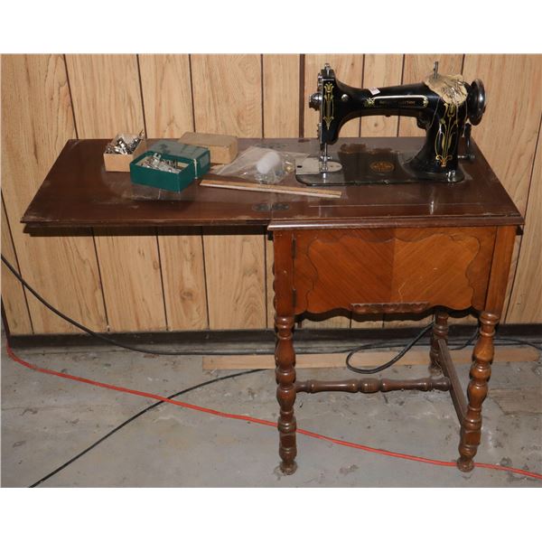 ANTIQUE SEWING MACHINE IN CABINET WITH SOME