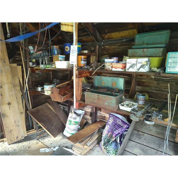 Wall of tools, hardware, and antique items