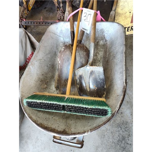contractors wheelbarrow with shovels and push broom
