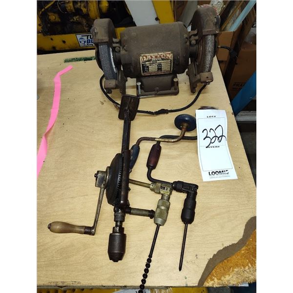 A Dayton grinder and three hand brace drills