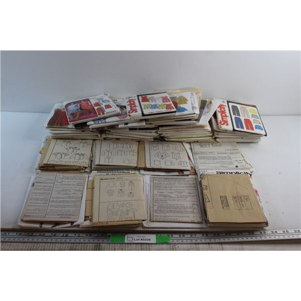 Assorted Clothing Patterns in Small Plastic Tote