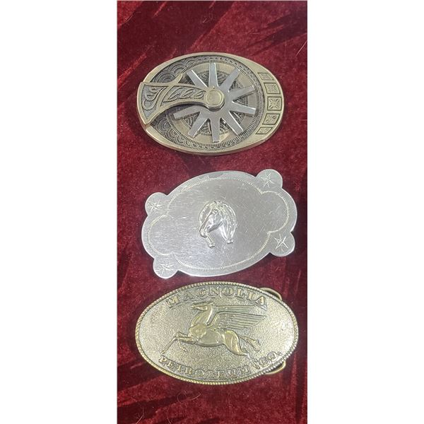 THREE BELT BUCKLES ONE HAS REVOLVING STREUP