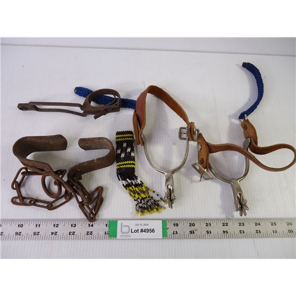 A Pair of Spurs, Trigger Guard, Beaded Item and Cow Kicker