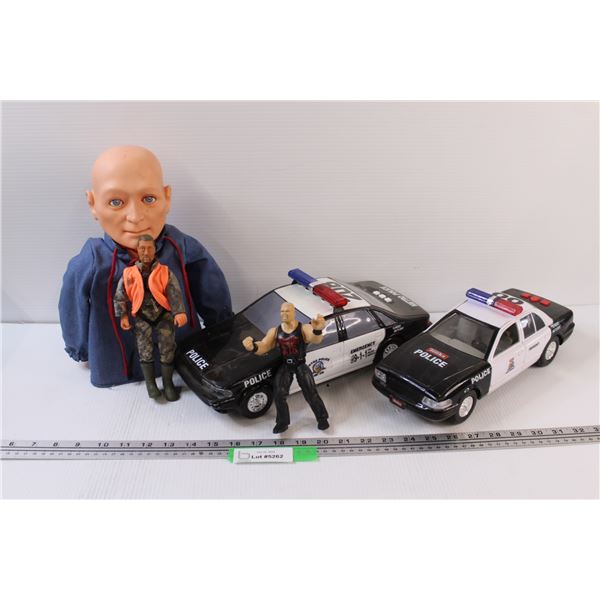 Lot: (2) Police Toy Cars, Steve Austin Figurine, Bust of a Man, Firearm Safety Dan Figurine