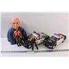 Image 1 : Lot: (2) Police Toy Cars, Steve Austin Figurine, Bust of a Man, Firearm Safety Dan Figurine
