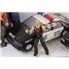 Image 2 : Lot: (2) Police Toy Cars, Steve Austin Figurine, Bust of a Man, Firearm Safety Dan Figurine