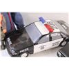 Image 5 : Lot: (2) Police Toy Cars, Steve Austin Figurine, Bust of a Man, Firearm Safety Dan Figurine