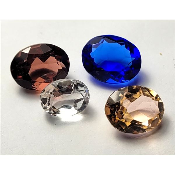 18)  LOT OF 4 LAB CREATED TOPAZ GEMSTONES, 36.5 CT