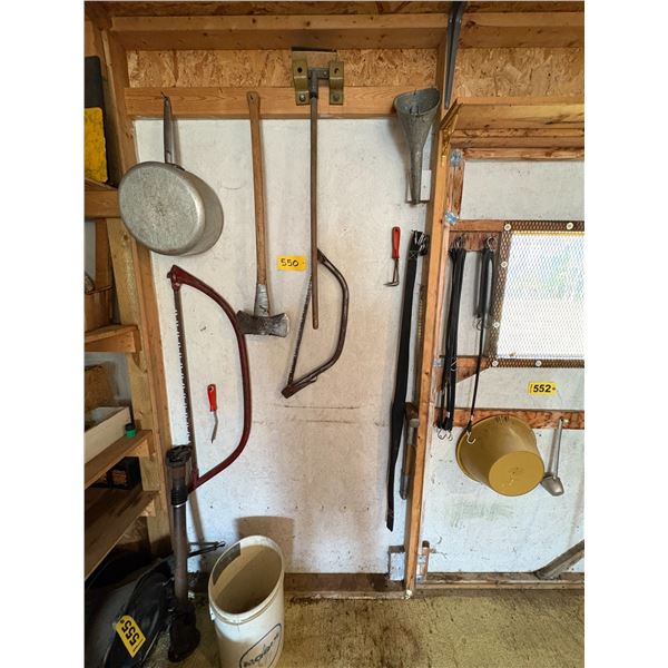Double headed axe, saws, funnel & misc. on wall