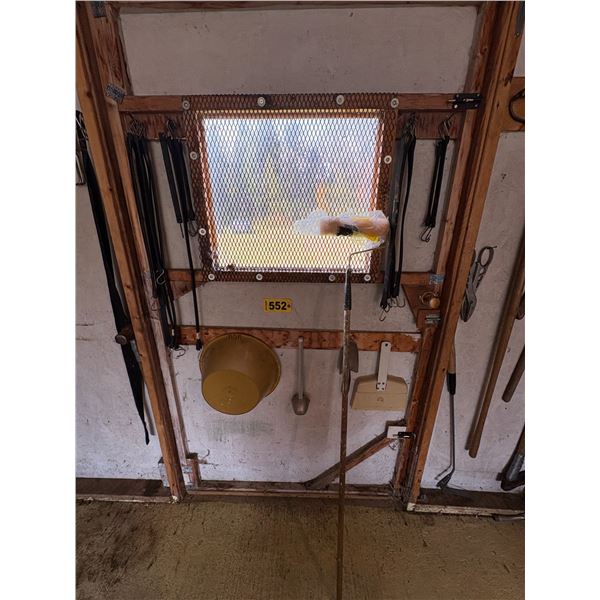 Bungee cords, snips, grass whip, plastic tub & misc. on wall