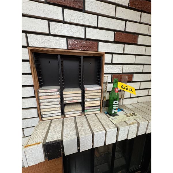 Cassette storage unit c/w qty of tape cassettes, vintage 7-Up bottle & 2- champagne glasses