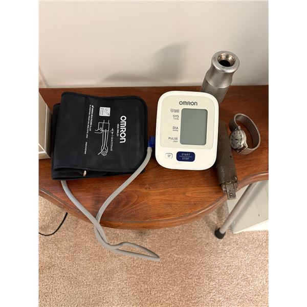 Omron blood pressure machine, watch, tin of shoelaces and misc.