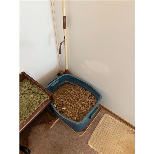 Bin of gravel, small stool, shoe horn and mop