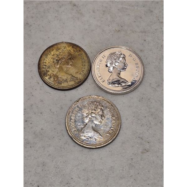 3 Canadian silver dollars