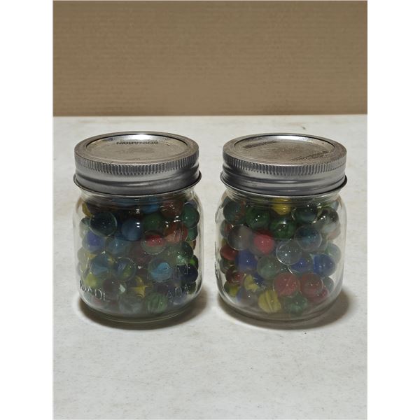 Two pint jars of marbles